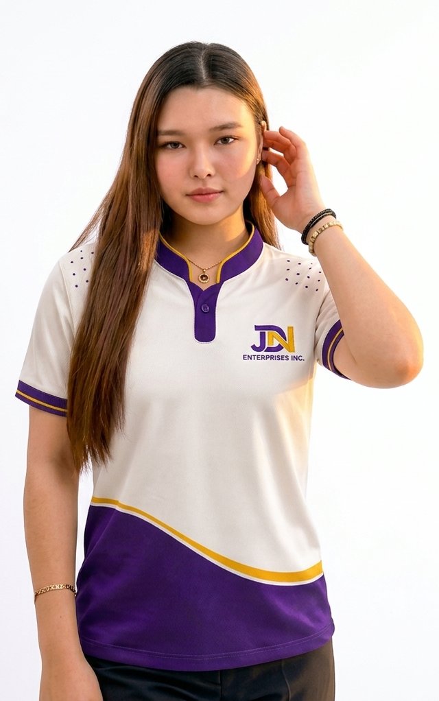 Team member wearing the JDN employee polo, facing the camera: white Chinese collar polo with purple wave, gold trim and embroidered JDN logo